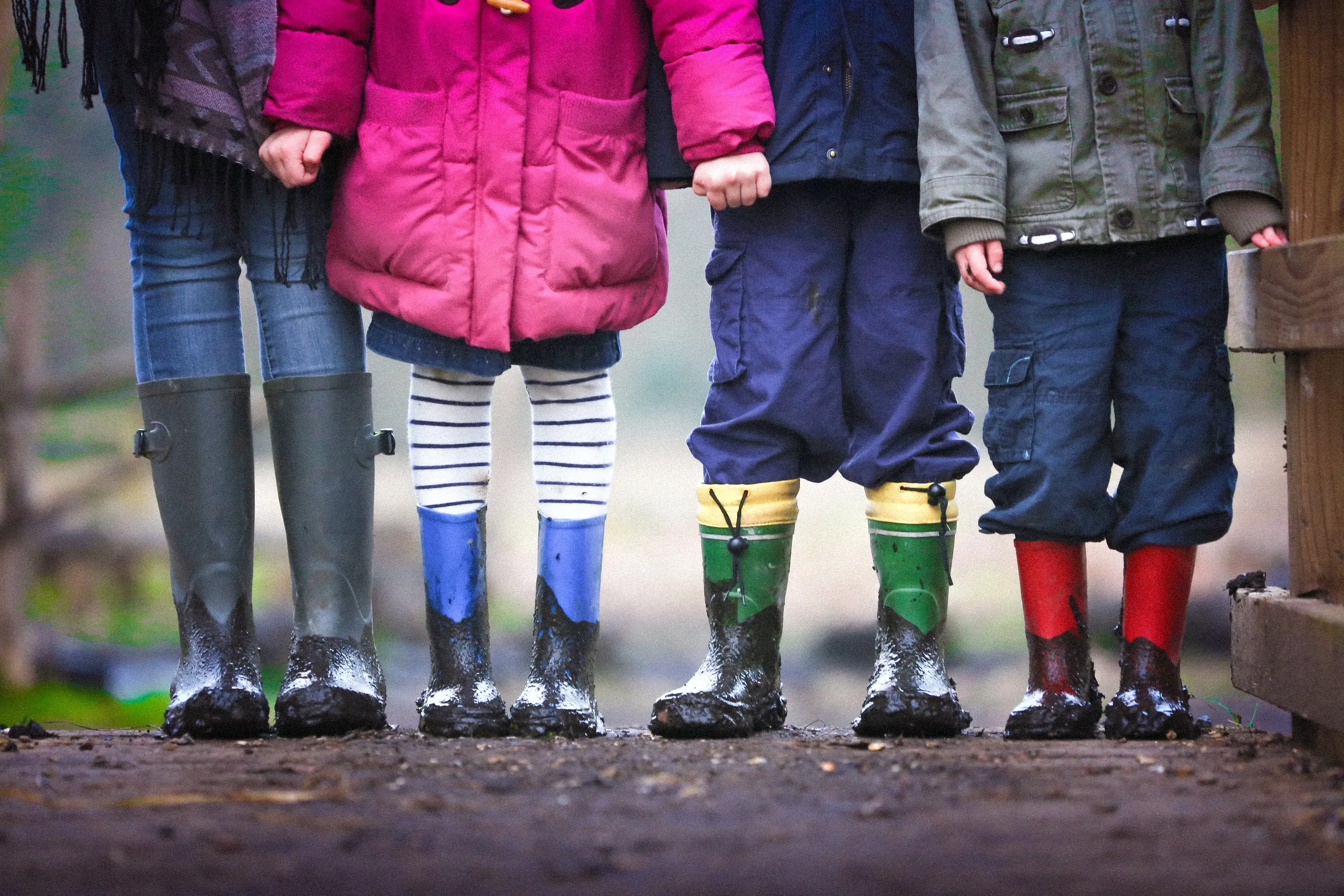 Four children standing together in a group